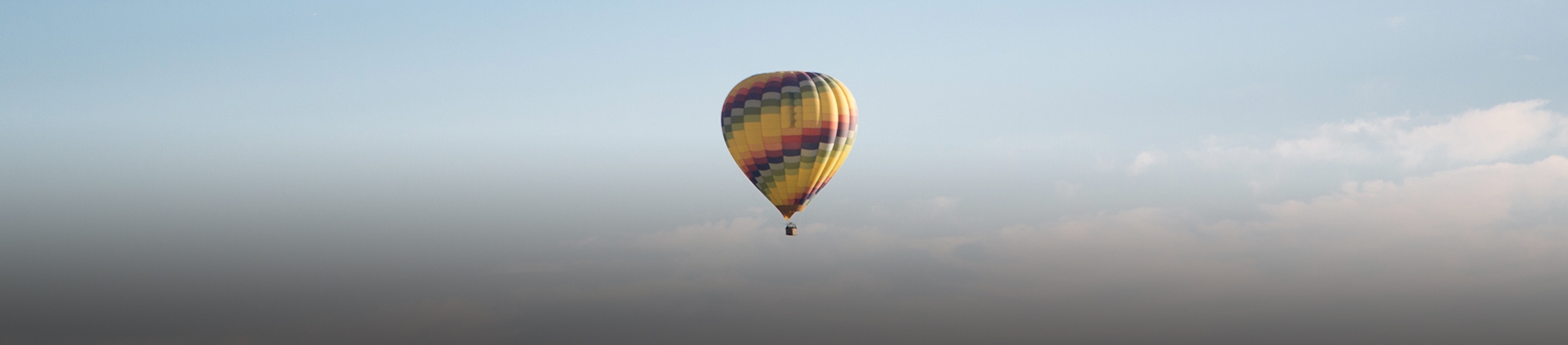 A coloured hot air balloon in the sky A coloured hot air balloon in the sky