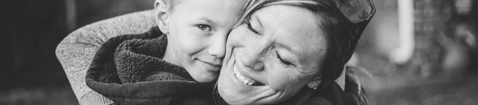 A women hugging her young child A women hugging her young child
