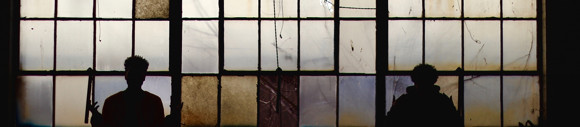 Two men looking out of stained windows Two men looking out of stained windows