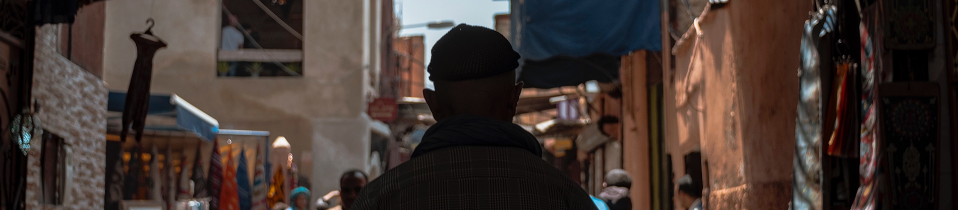 A man walking through a old town A man walking through a old town