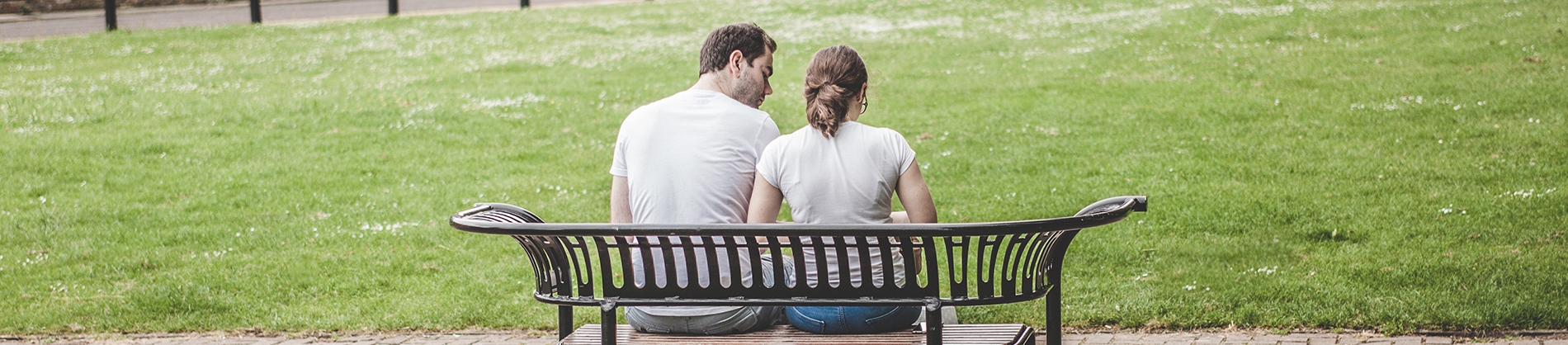 Two people sat on a park bench Two people sat on a park bench