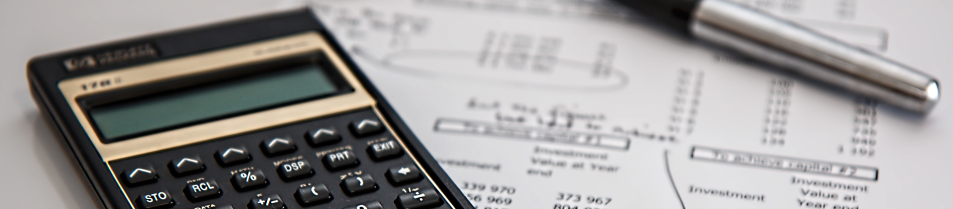A calculator on top of a finance sheet