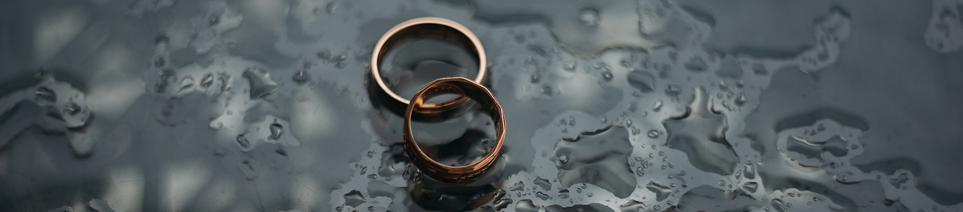 Wedding rings on a rainy floor Wedding rings on a rainy floor
