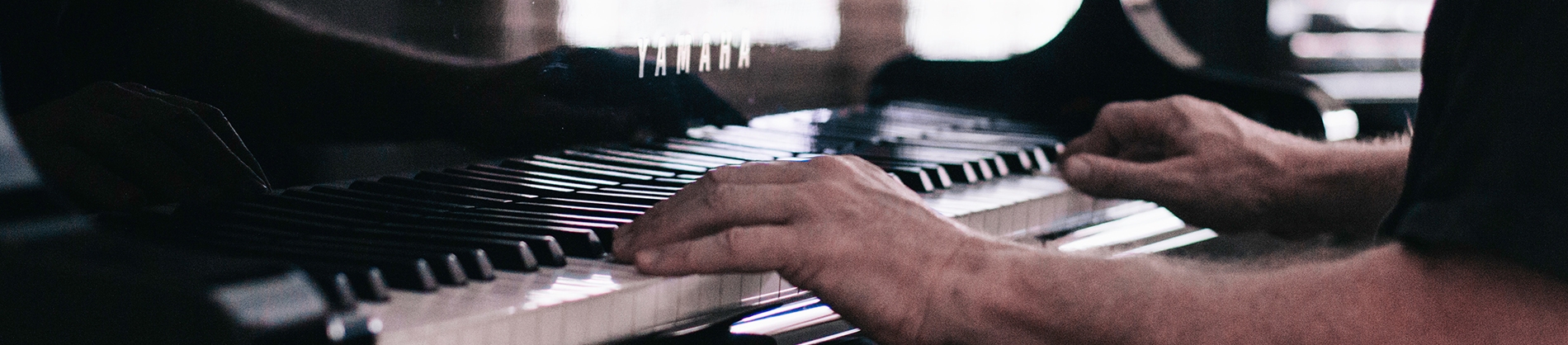 A man sat playing the piano