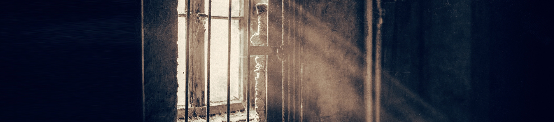 A small window with bars across it A small window with bars across it