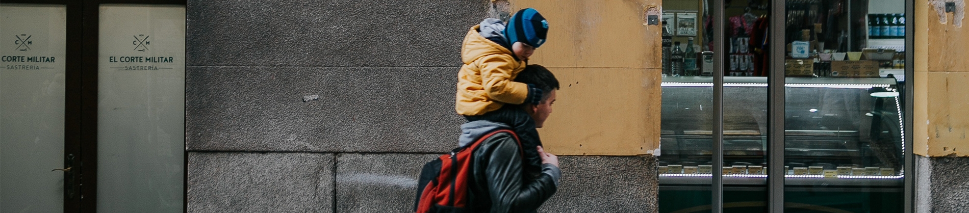 A father carrying his child on his shoulders A father carrying his child on his shoulders