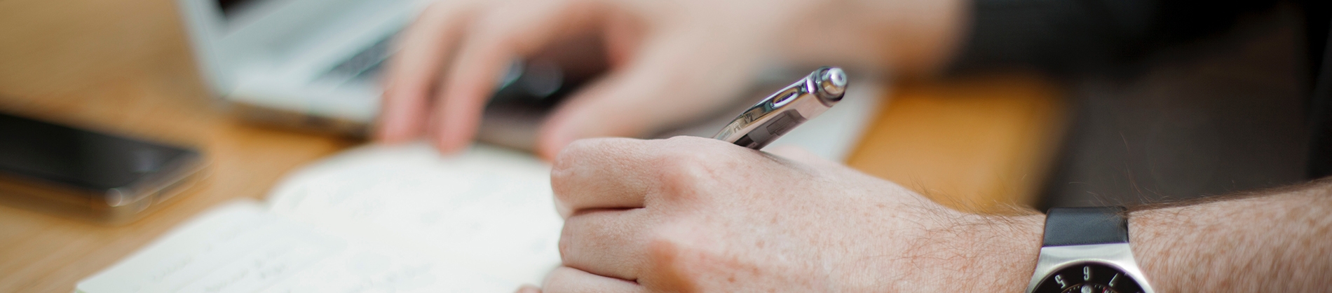 Man writing in a notebook