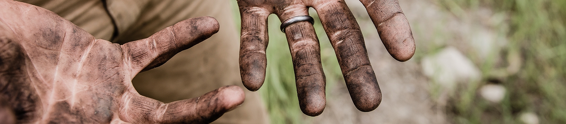A man with dirt on his hands A man with dirt on his hands