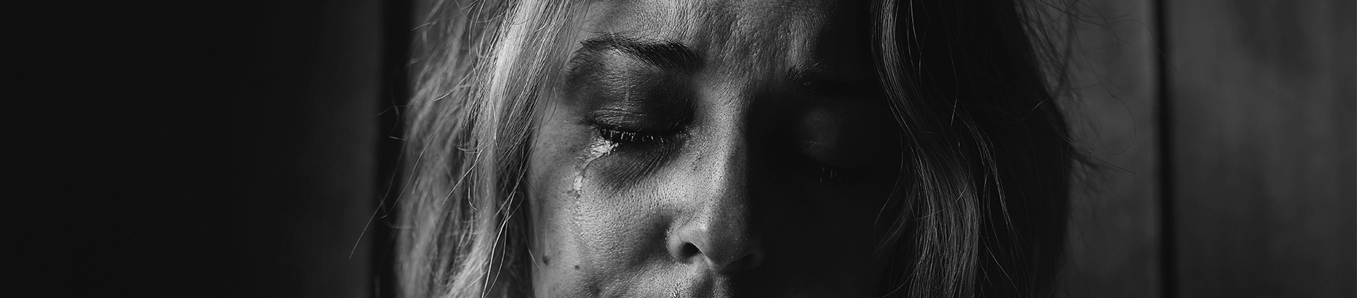 A women with tears coming down her face A women with tears coming down her face