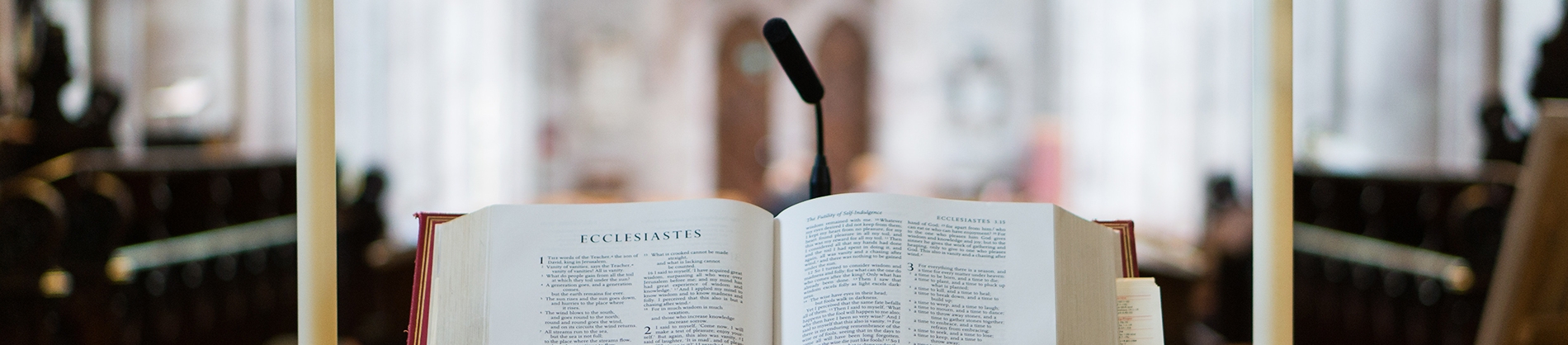 A bible on a stand at the front of a church