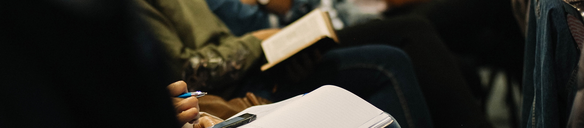 Congregation sat in church reading bibles and writing notes Congregation sat in church reading bibles and writing notes