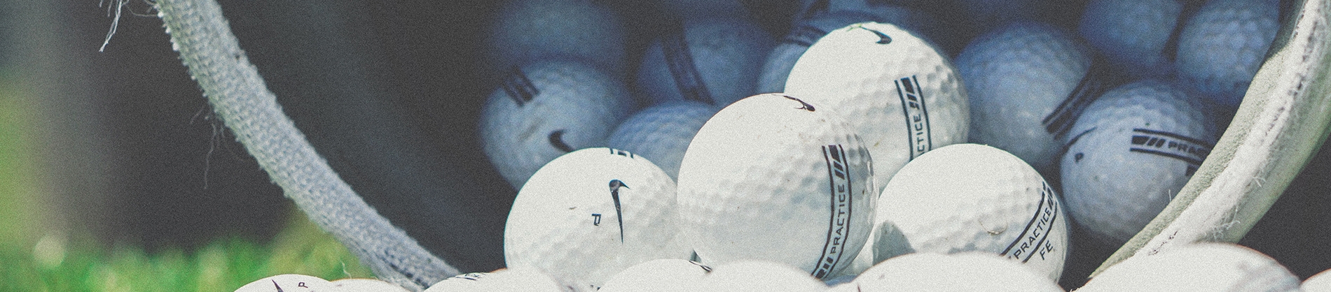 Golf balls in a large bucket Golf balls in a large bucket