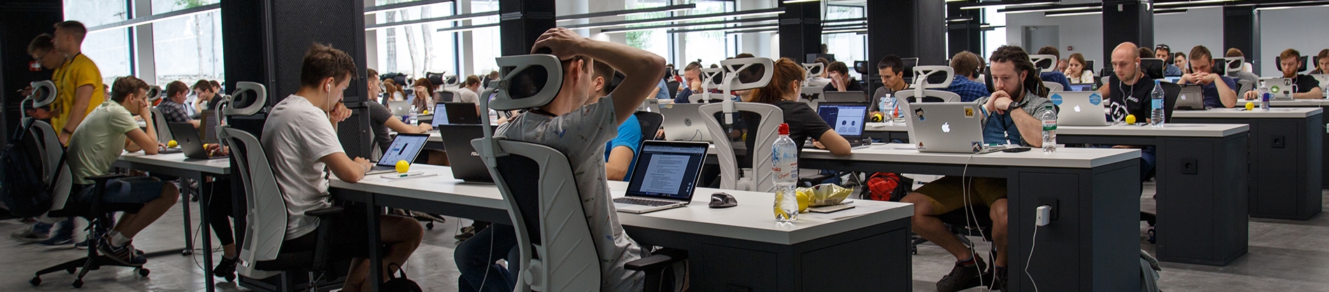 Employees sat a desks working on computers in an office