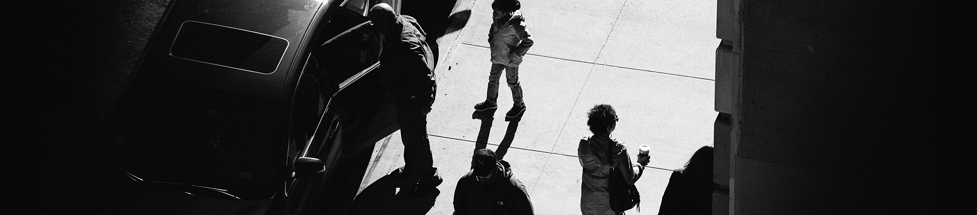 A black and white photo birds eye view of a street of people A black and white photo birds eye view of a street of people