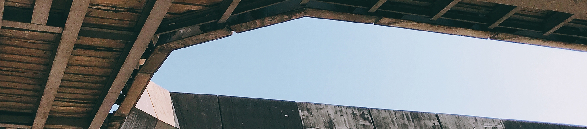 A open hole in a wooden roof of a building A open hole in a wooden roof of a building