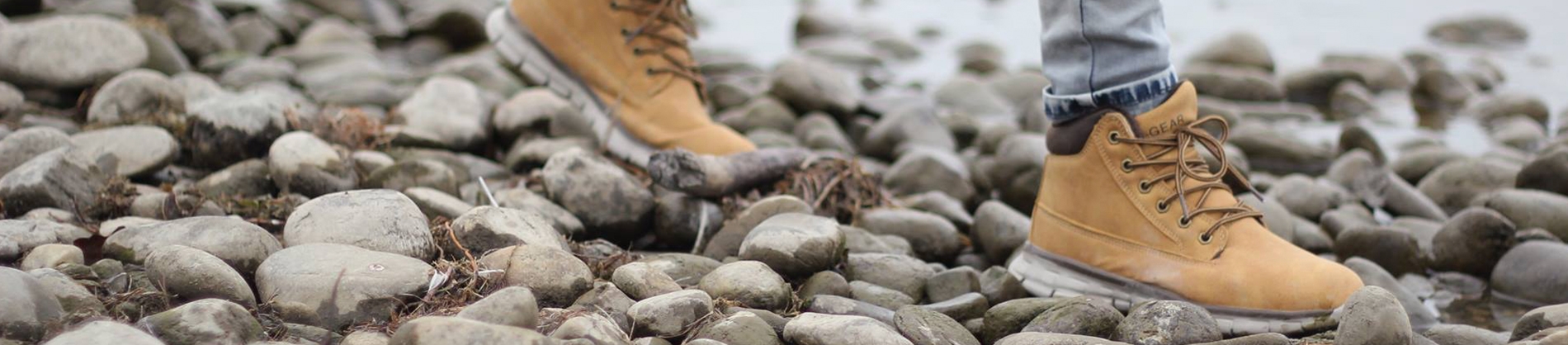 Women walking over rocks and stones