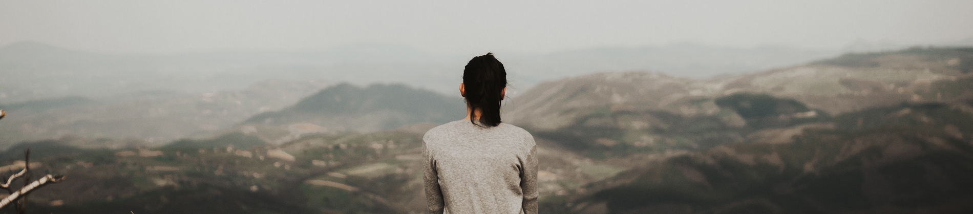A women looking out onto a landscape A women looking out onto a landscape