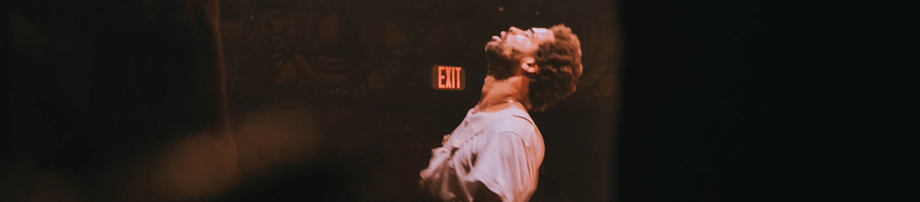 A man with his eyes closed and face towards the sky in prayer A man with his eyes closed and face towards the sky in prayer