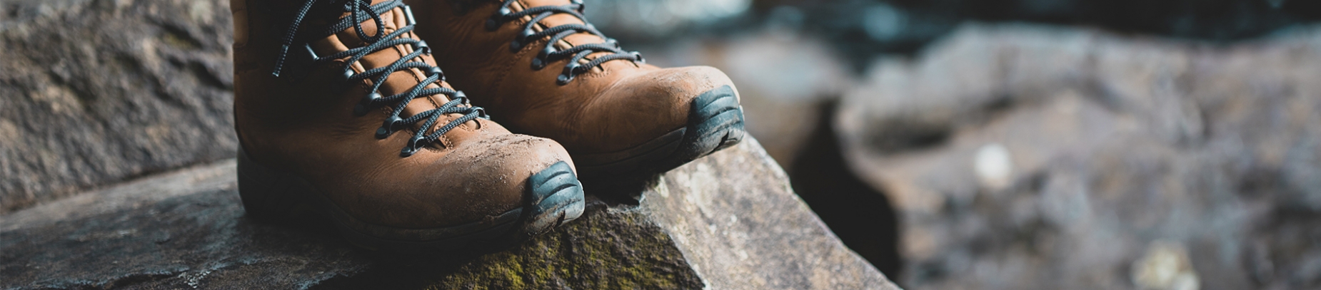 Walking boots on a rock Walking boots on a rock