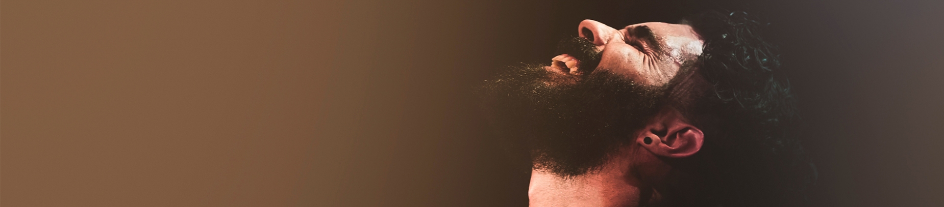A man facing upwards with his eyes closed and mouth open in worship A man facing upwards with his eyes closed and mouth open in worship