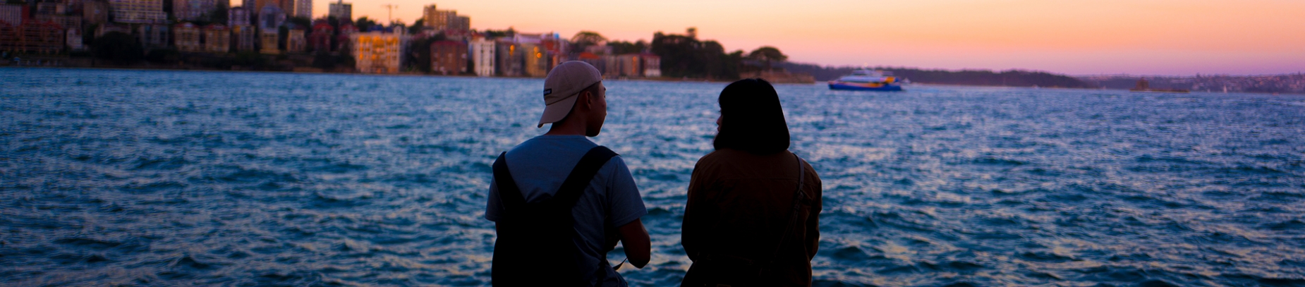 Two friends talking and looking over the ocean Two friends talking and looking over the ocean