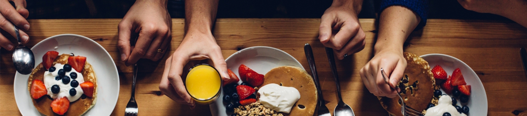 Three people having breakfast together Three people having breakfast together