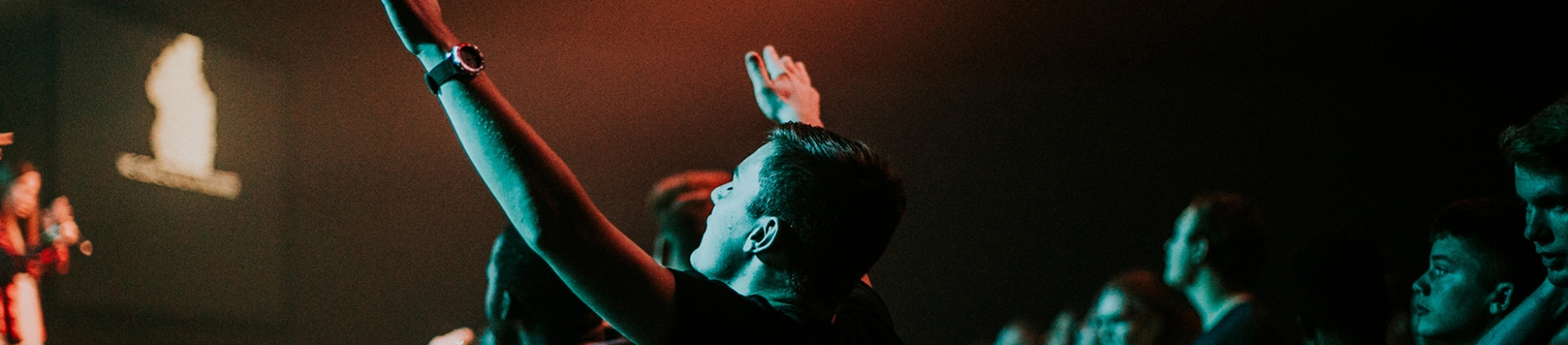 A man worshipping at church A man worshipping at church