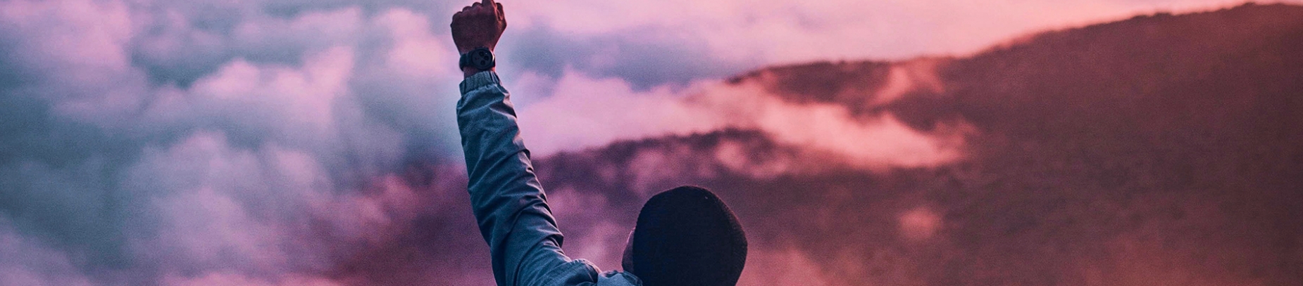 A man with his arm raised in the air A man with his arm raised in the air
