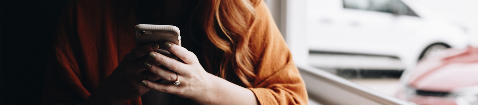 A women using her mobile phone A women using her mobile phone