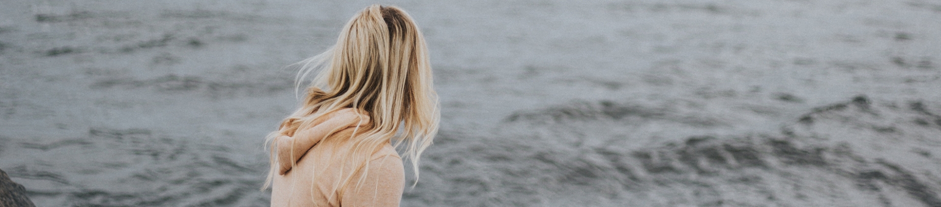 A women looking out across the sea