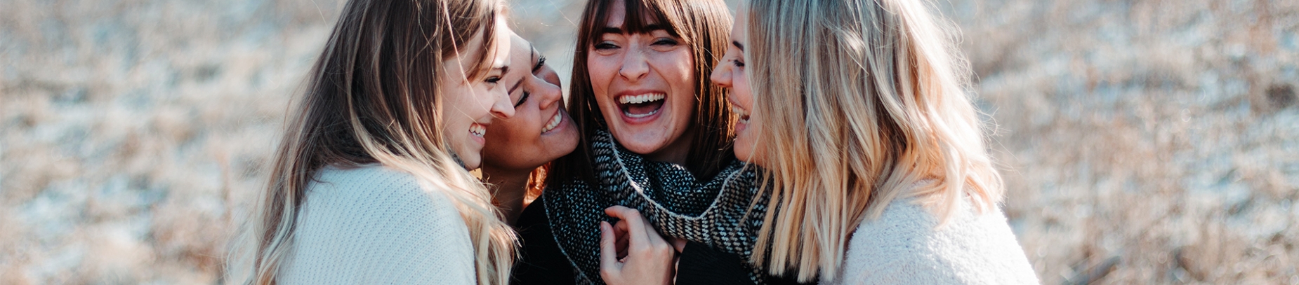 four friends laughing together four friends laughing together