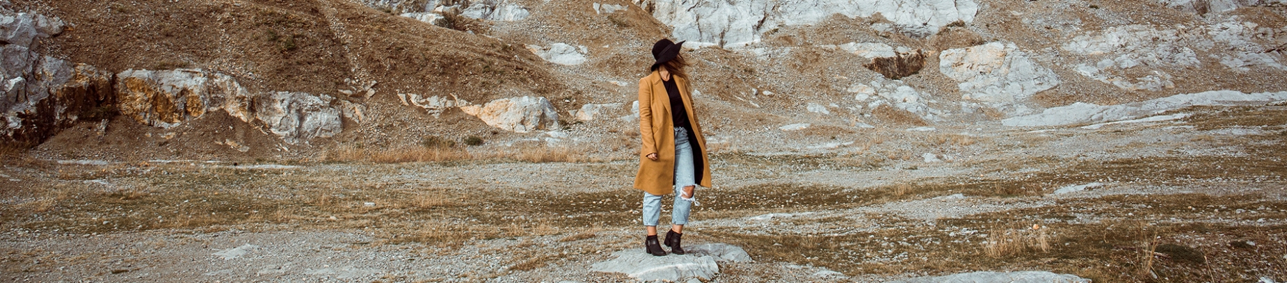 Women stood in the middle of a rocky landscape