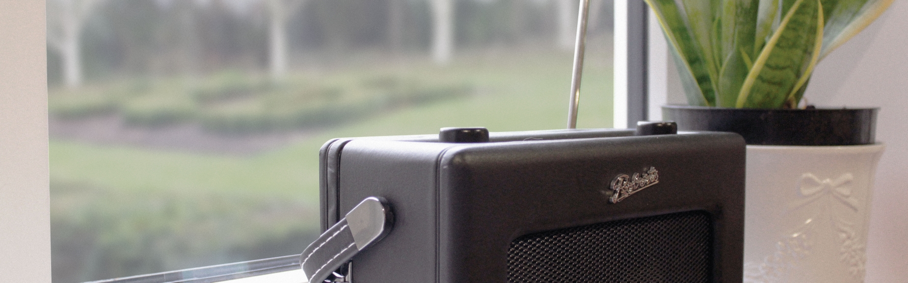 Radio perched on a window ledge